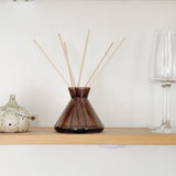 Contemporary glass diffuser bottle décor on shelf