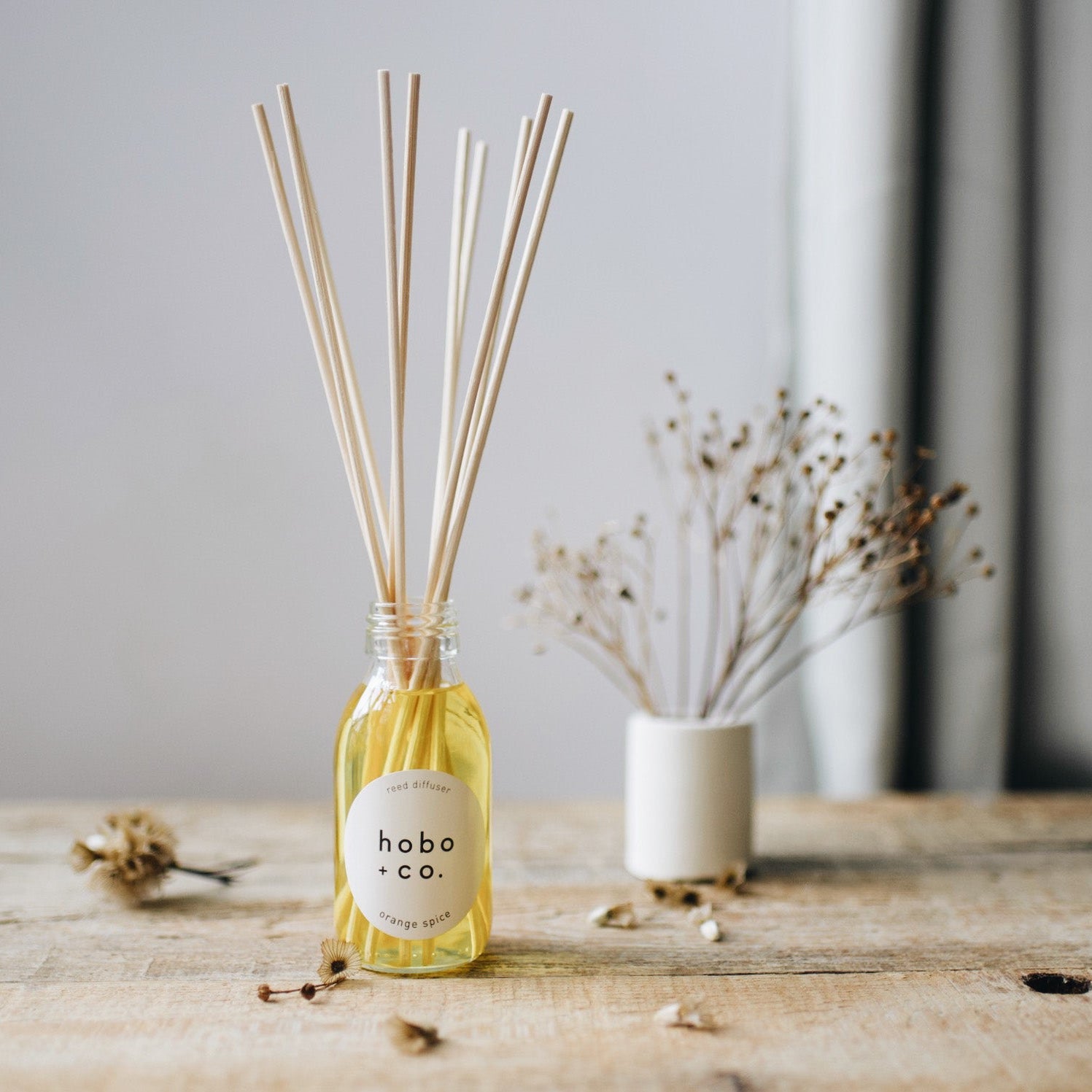 winter diffuser on rustic table with grey background