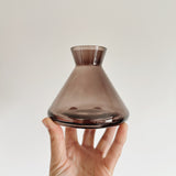 Smoke grey glass reed diffuser bottle in hand