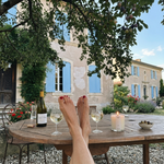 lit fig candle on a summer drinks table