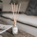 Lemongrass and coconut Reed diffuser with 'hobo & co' label on a wooden surface in a home setting